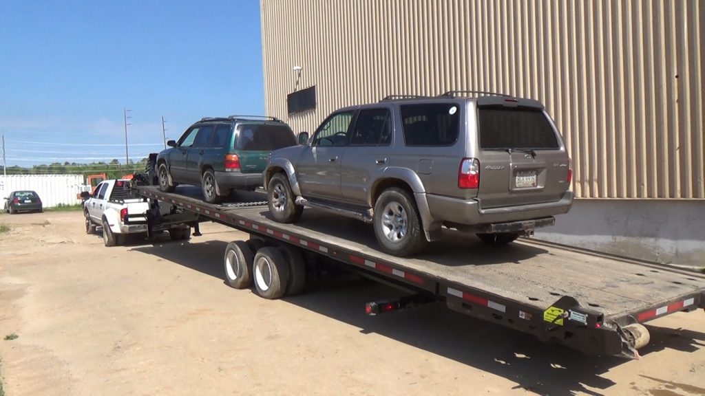 A 40' QuickLoadz trailer with two cars loaded on the bed. The cars were loaded with the tow package. 