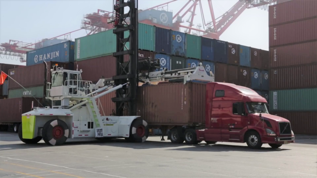 Crane loading container chassis at port